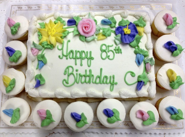 Birthday cake with cupcakes